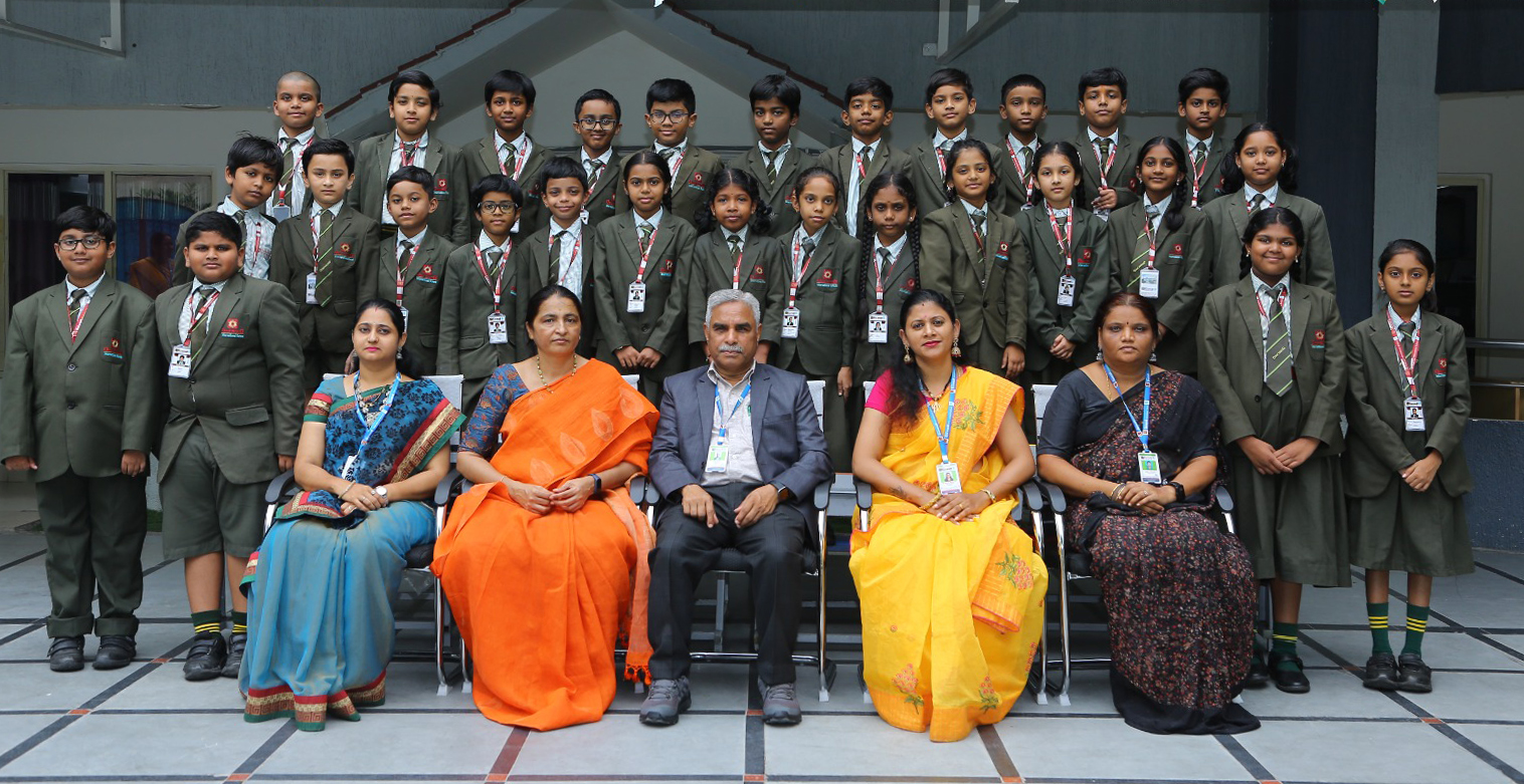 Oakwood primary students with faculty members